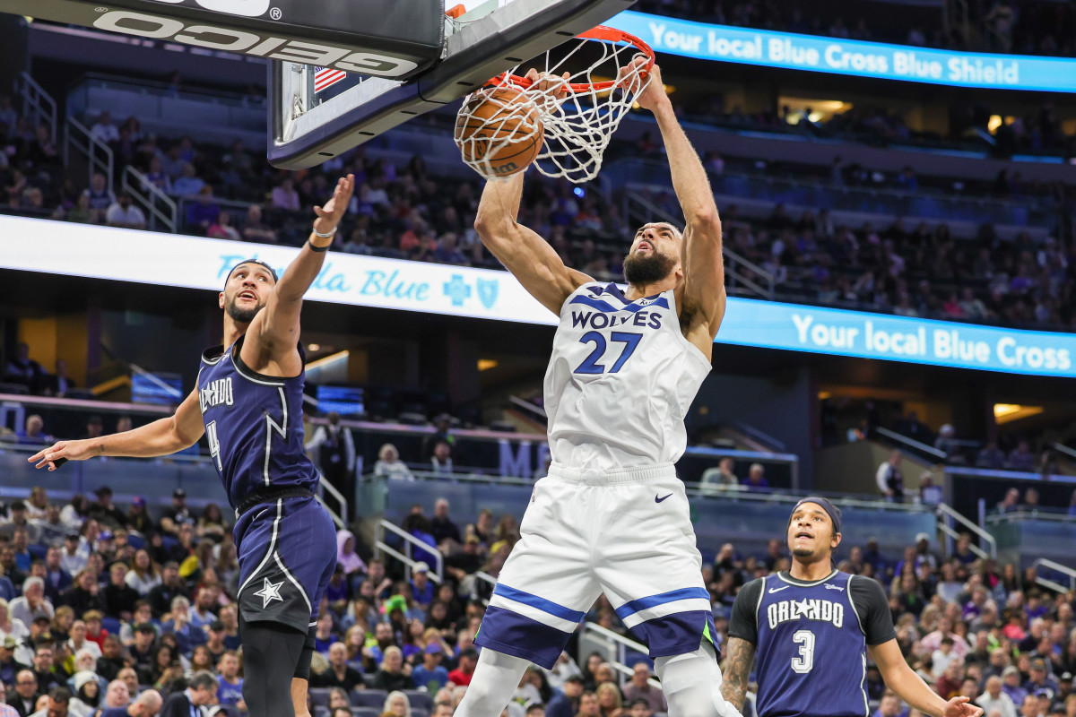 Rudy Gobert (27) dunks the ball against the Orlando Magic. 